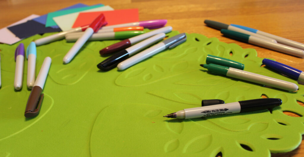 Pile of markers on floor